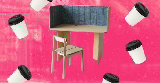 A wooden test with a blue interior panel surrounded by coffee cups. 