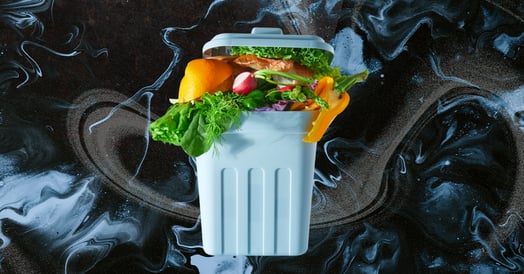 A pale blue trash can full of produce.