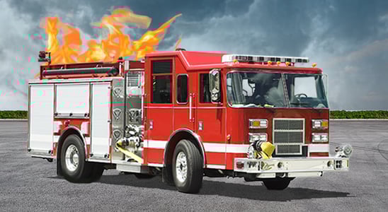 A red fire truck appears to be on fire on its top, against a dramatic, cloudy sky.