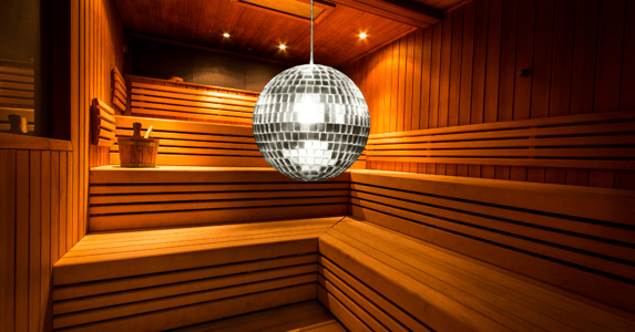 A disco ball hangs in a sauna.