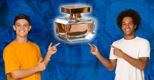 Two teenage boys pointing to a bottle of perfume.