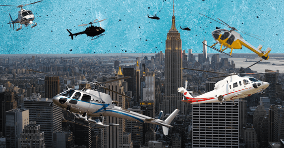 The New York City skyline with multiple helicopters flying overhead.