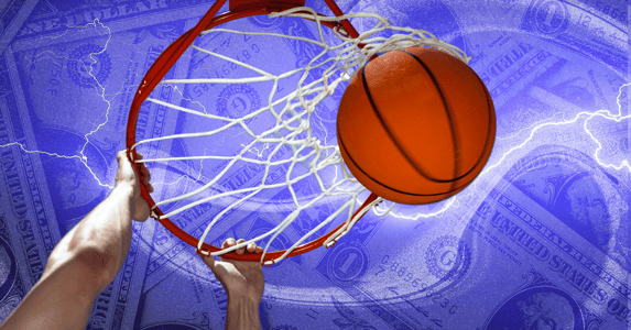 Hands dunking a basketball through a hoop on a purple background covered in dollar bills.