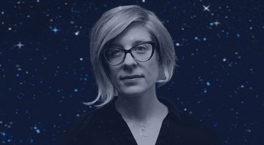 A portrait of Kathryn Nicolai, a woman with short blonde hair and cat-eye glasses, set against a dark, starry background.
