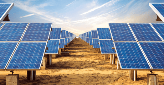Rows of solar panels under a blue sky